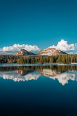 Snowy mountains reflecting in Trial Lake, in the Uinta Mountains, Utah