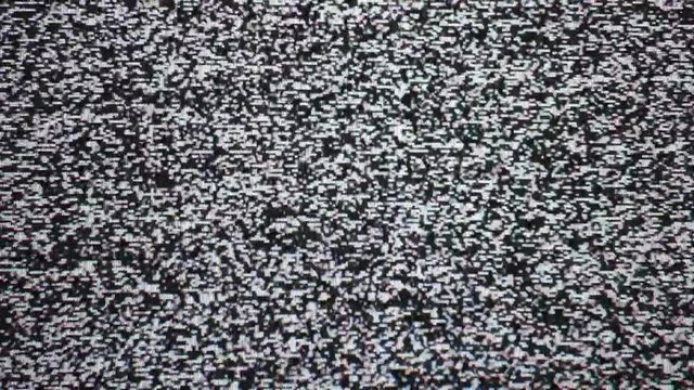 Video error. Abstract noise of analog television. Digital glitch. Damage to the video signal with pixel noise and noise. Black and white dreaming background. Retro tv.