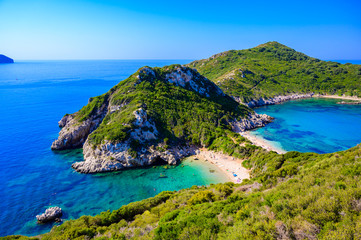 Fototapeta na wymiar Porto Timoni beach at Afionas is a paradise double beach with crystal clear azure water in Corfu, Ionian island, Greece, Europe