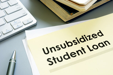 Unsubsidized student loan form and keyboard.