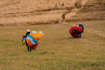 Paragliders preparing for flight