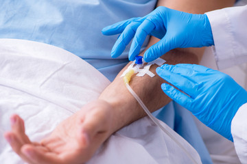 Male patient in blood transfusion concept