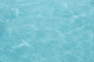 Surface of swimming pool water background.