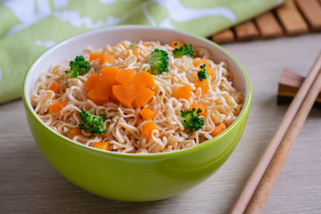 Instant noodle with vegetables in bowl