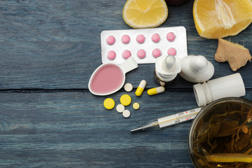 Medicines, pills, cough syrup, thermometer and folk remedies for the treatment of influenza and the...