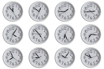 Set of white analog round office clocks showing various time isolated on white background
