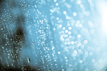 Fototapeta na wymiar Natural water drops on glass