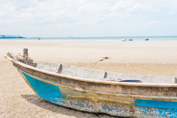 Boat wreck ( Broken wooden boat ) on the sand in the beach.