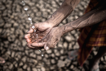 Elderly men are exposed to rainwater in dry weather,global warming,selective focus