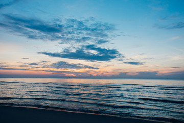 Fototapeta na wymiar Colorful ocean beach sunrise.