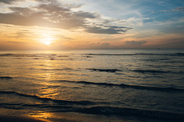 Colorful ocean beach sunrise.