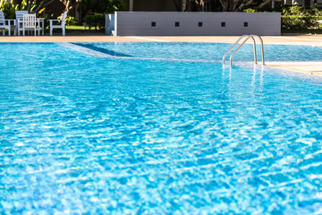Ripple Water in swimming pool with sun reflection