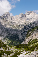 Fototapeta na wymiar Green valley with high mountains