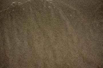 Onde sulla sabbia in spiaggia d'estate