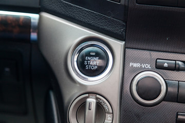 Fototapeta premium View to the interior of car with dashboard, start-stop button after cleaning before sale on parking