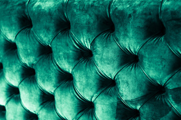 Emerald luxury velour quilted sofa upholstery with buttons, elegant green home decor texture and...