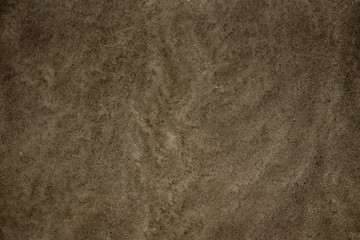 Onde sulla sabbia in spiaggia d'estate