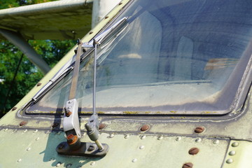 the cleaning mechanism glass cockpit of the old plane, the cockpit, wiper blade, dirty glass, storing equipment outdoors