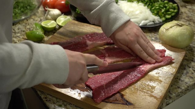 Slicing Steak on a Cutting Board in Slow Motion.
