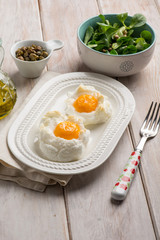 owen eggs eith salad capers and olive oil