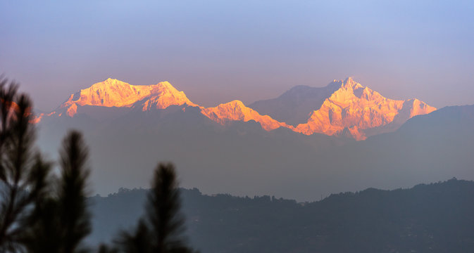 A view of Snow clad Kangchenjunga, also spelled Kanchenjunga, is the third highest mountain in the world. It lies between Nepal and Sikkim, India,  