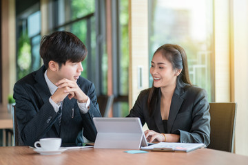Team of business analysts discussing the business strategy in contemporary office room 