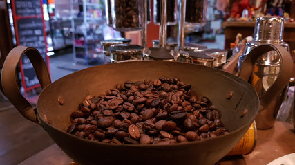 Coffee seeds in a roasted pan preparing for make the coffee drink