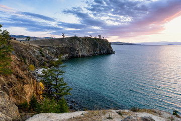 Lake Baikal, trees and mountains of Siberia with beautiful sky and clouds, Russia Oklhon island