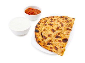 Indian Traditional Breakfast Dish Aloo Paratha is a Potato Stuffed Flatbread Served With Fresh Curd And Pickle 