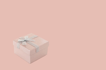 pink glossy gift box isolated on pink background