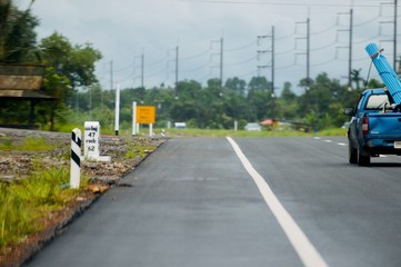 traveling on the evening local road in the evening light on the wet rain highway
