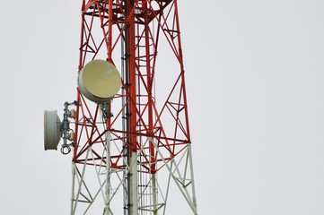 Telecommunications tower, Telecommunication mast TV antennas wireless system technology with cloudy blue sky, 
