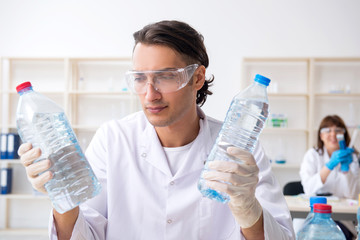 Two chemists working in the lab