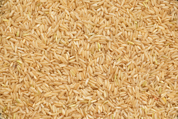Grain brown rice background. Brown rice is whole grain. Food background. Top view  