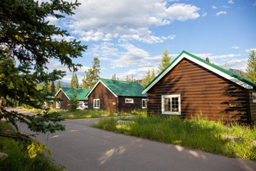 Fototapeta na wymiar Cozy log cabin in a national park resort in Canada in the Canadian Rockies