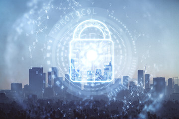 Lock icon hologram on city view with skyscrapers background multi exposure. Data security concept.
