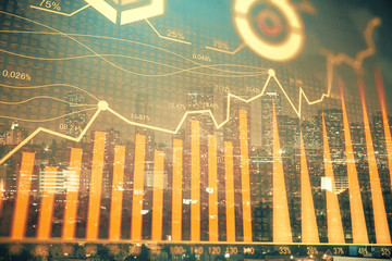 Financial graph on night city scape with tall buildings background multi exposure. Analysis concept.