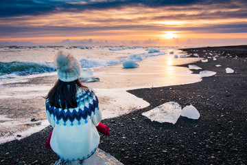 Woman enjoying Diamond beach sunset in Iceland © creativefamily