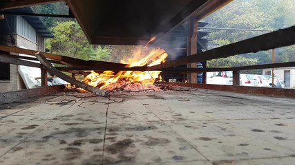 Grill with pans in which chestnuts are cooked, Vittorio Veneto, Italy