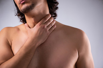 Young man suffering from neck pain