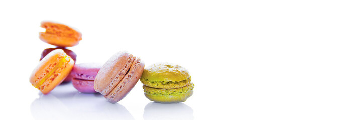 Pyramid of pastel colored french macarons, isolated on panoramic white background