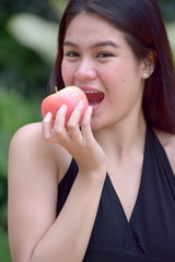 An Eating Asian Female With Food