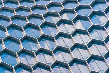 Office buildings. Structure of hexagon windows in futuristic technology network connection concept....