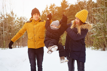 Fototapeta na wymiar happy family walking in winter day. Family, weekend and holiday concept