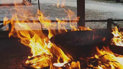 Slow motion of steaming chestnuts while they are cooked over the fire, Vittorio Veneto, Italy
