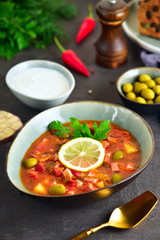 traditional russian meat soup solyanka. The finished dish. Close-up.
