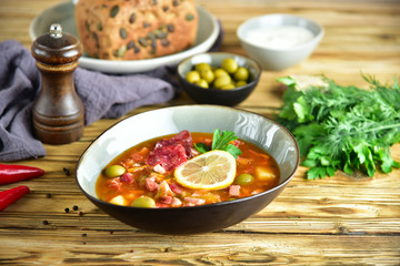 traditional russian meat soup solyanka. The finished dish. Close-up.