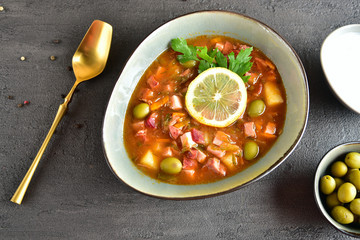 traditional russian meat soup solyanka. The finished dish. Close-up.