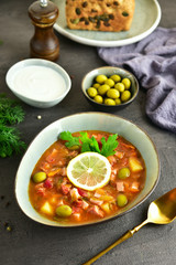 traditional russian meat soup solyanka. The finished dish. Close-up.