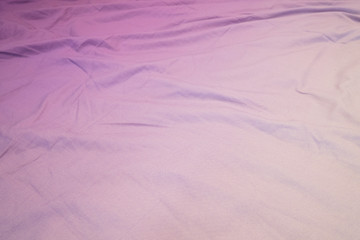 Crumpled background in white and purple colors, gradient texture